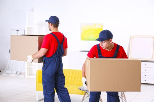 Removal van and packed boxes prepared for house removals in Leyton
