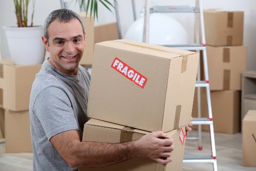 Removal company team loading a van in Leyton