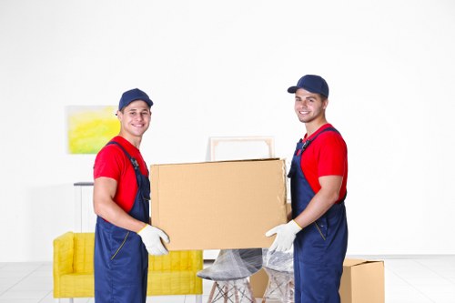 Man and van loading furniture in a Leyton street