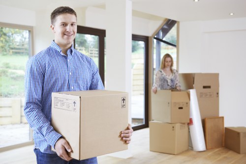 Professional movers preparing a Leyton removal van for loading