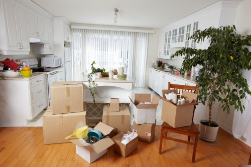 Team preparing sofas and bulky furniture for transport in Leyton