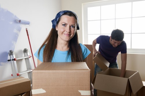 Packed boxes and furniture loaded into a Leyton moving van