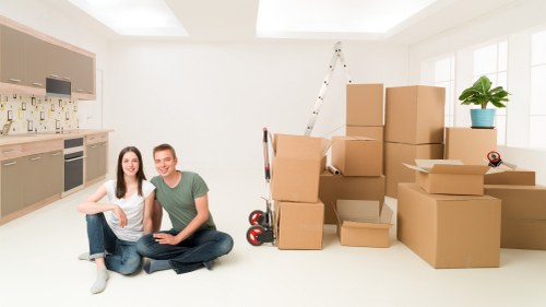 Packed moving boxes and furniture ready for removals in Leyton