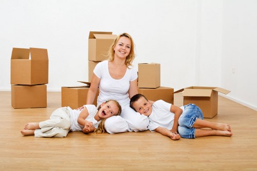 Removal specialists transporting furniture in Leyton