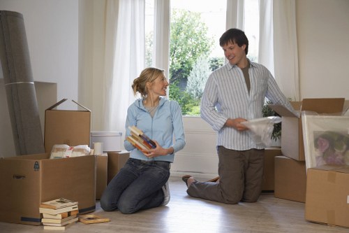 Mover carrying furniture safely with proper lifting technique