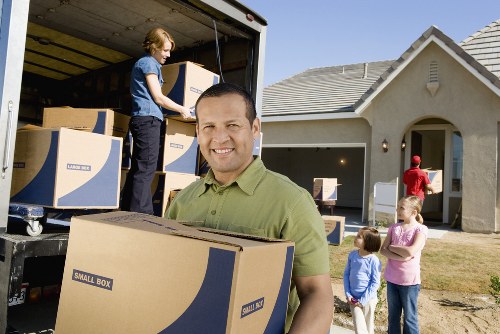 Local moving service loading furniture in Leyton