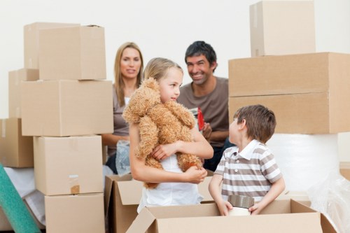 Professional Leyton movers packing household belongings into sturdy boxes